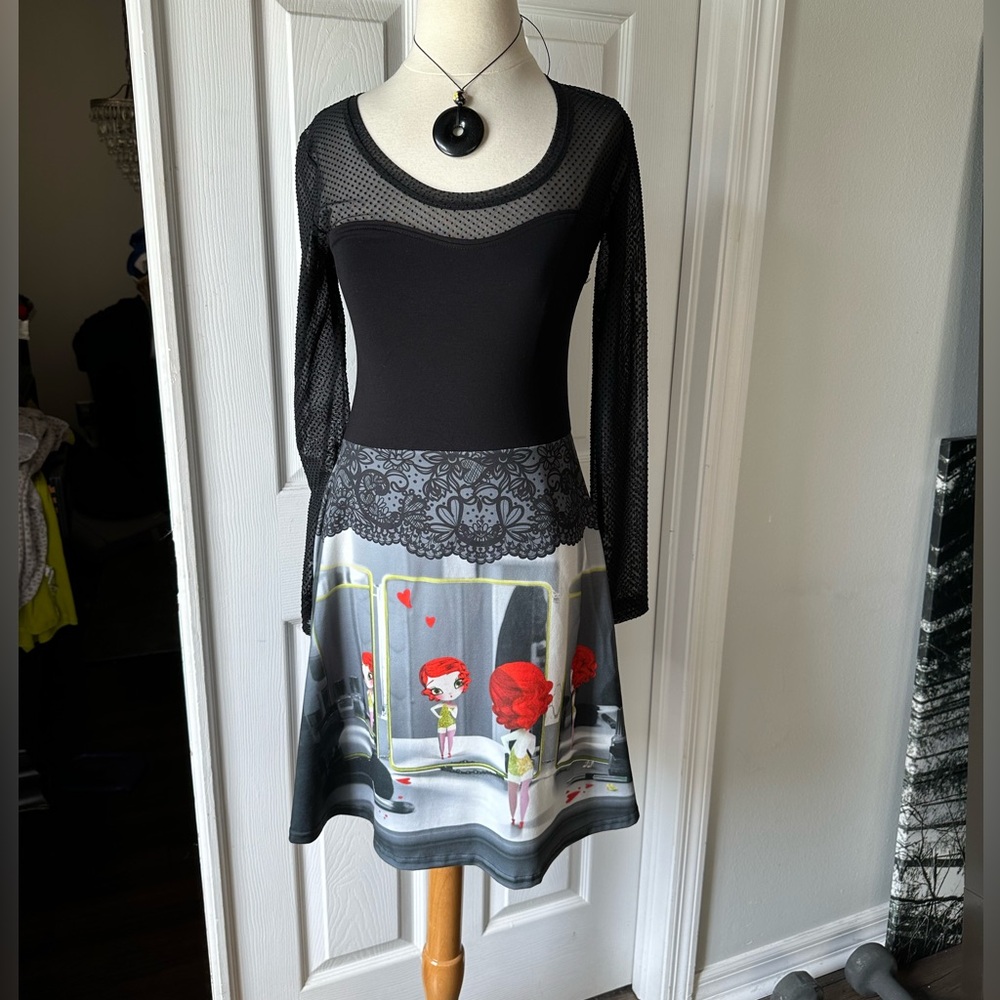 fun unique dress ! slight flare skirt and a sheer back and sleeves.